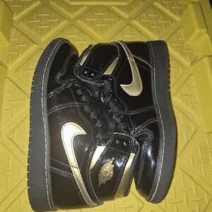 Jordan Black and Gold Sneakers